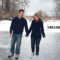 couple skating on frozen pond