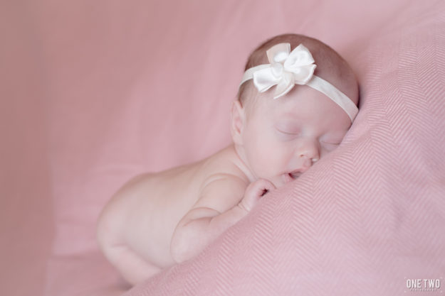 baby girl in pink newborn photography