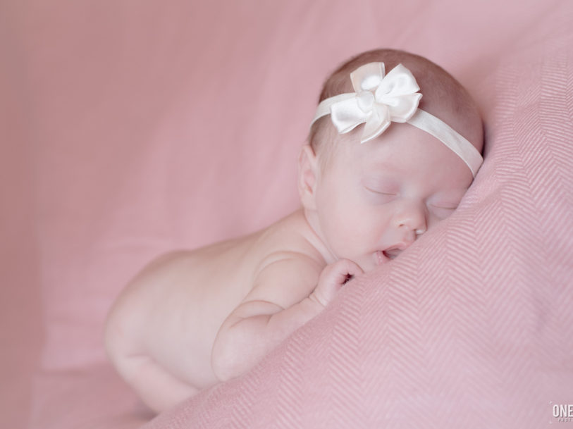 baby girl in pink newborn photography