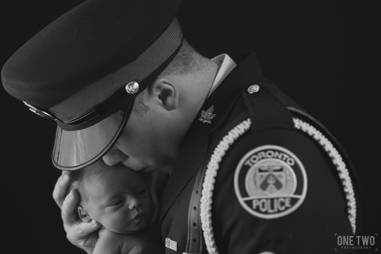 OneTwo_Wesley_Newborn_Photography-35 father newborn son police portrait